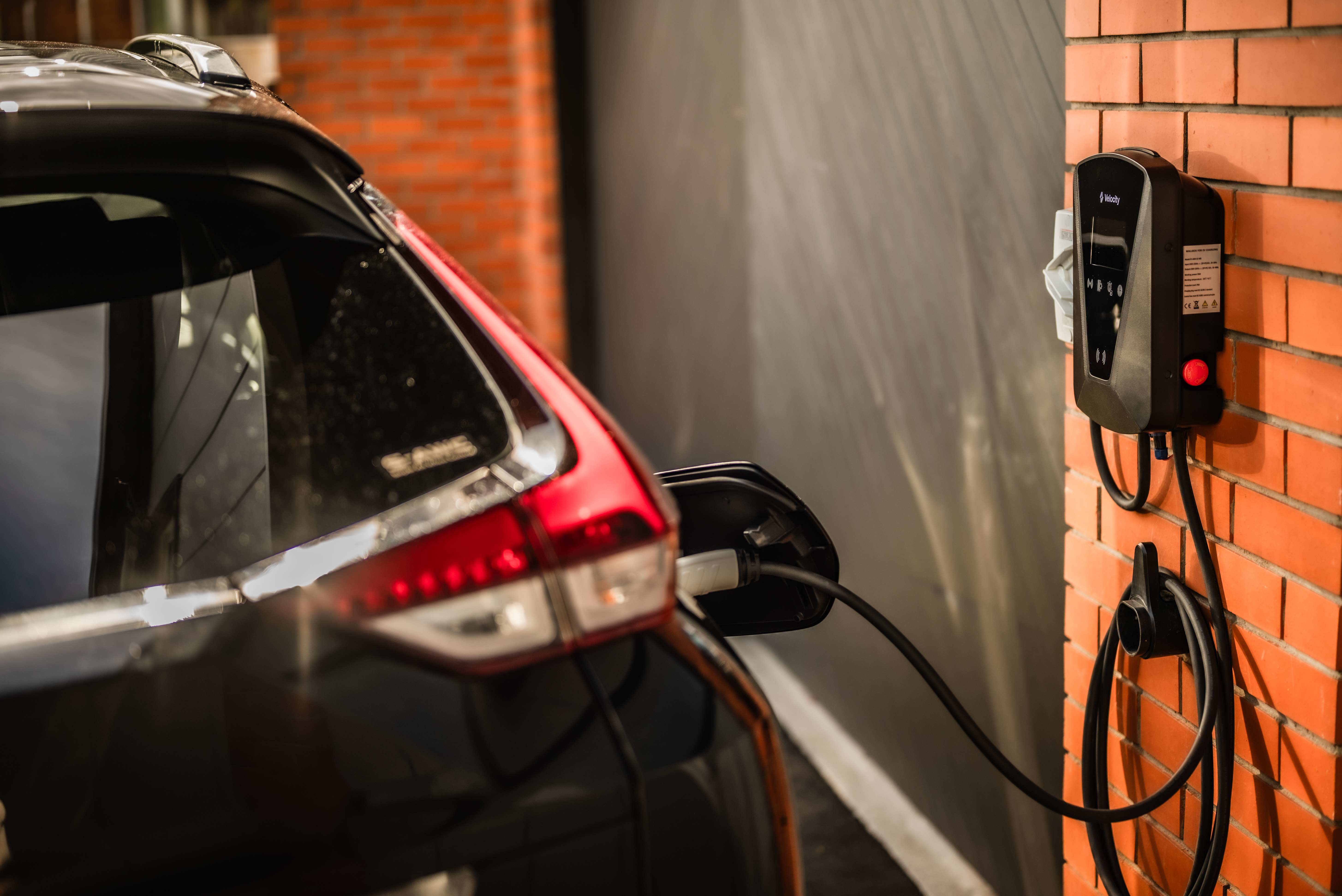 Velocity EV Charger on brick wall. 