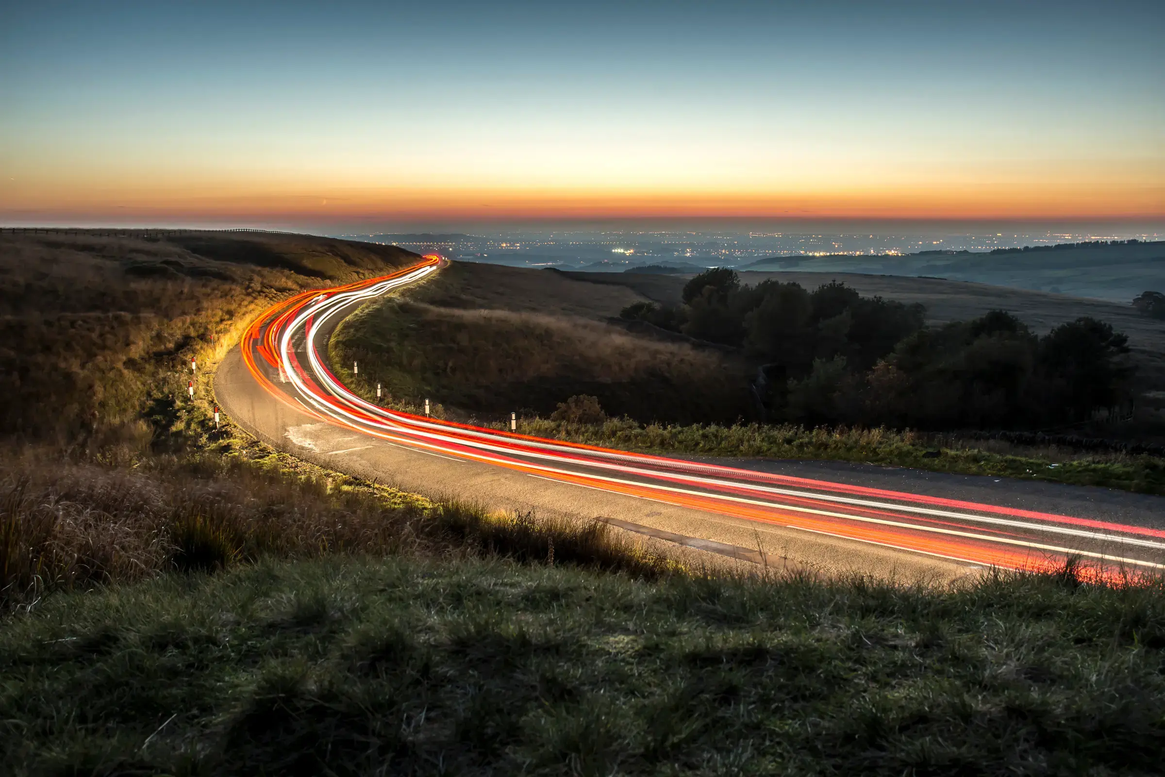 car-lights-streak-hills