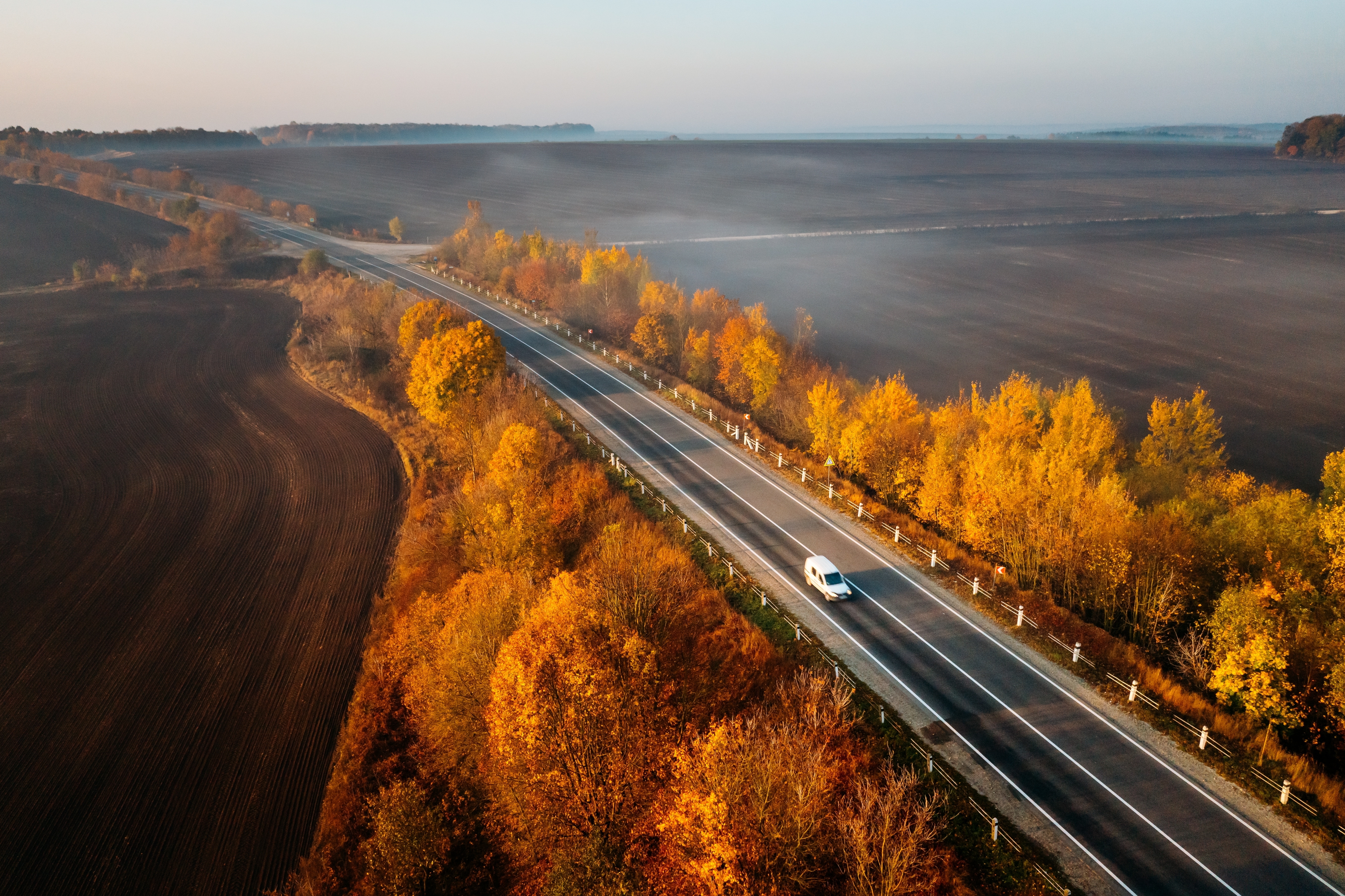 Car driving on road in Autumn